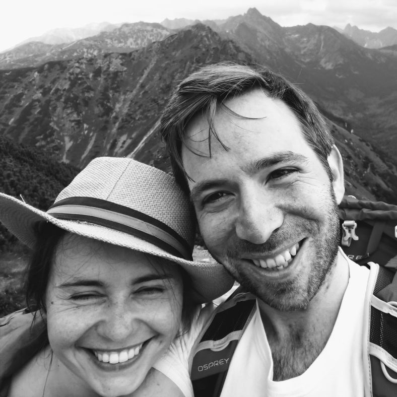 A photo showing the company founders smiling on top of a mountain